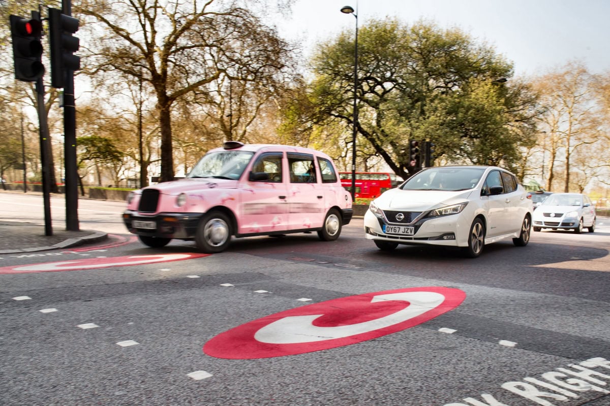 London taxi and cars on city street