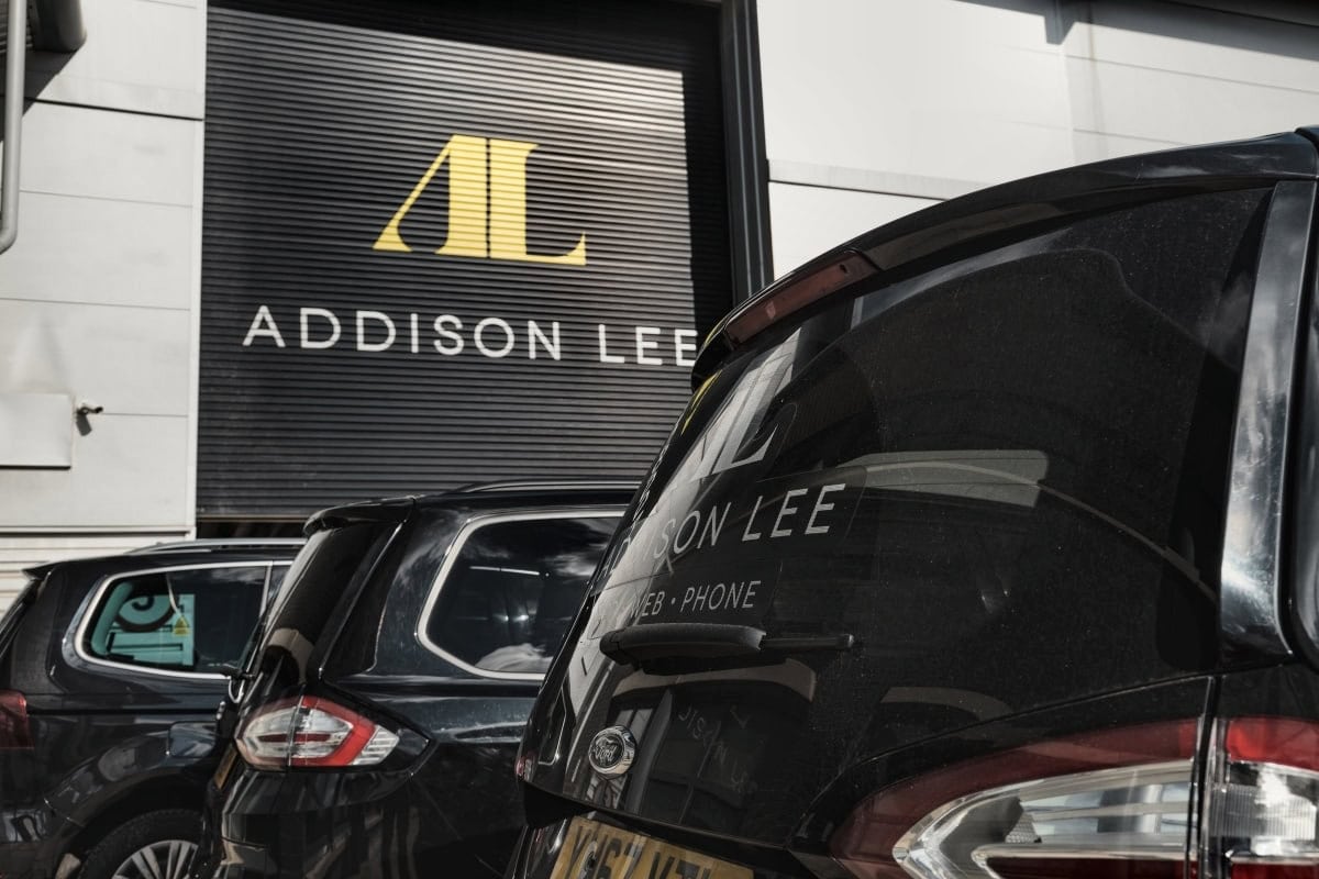 Addison Lee vehicles parked outside company garage for chauffeur drivers.